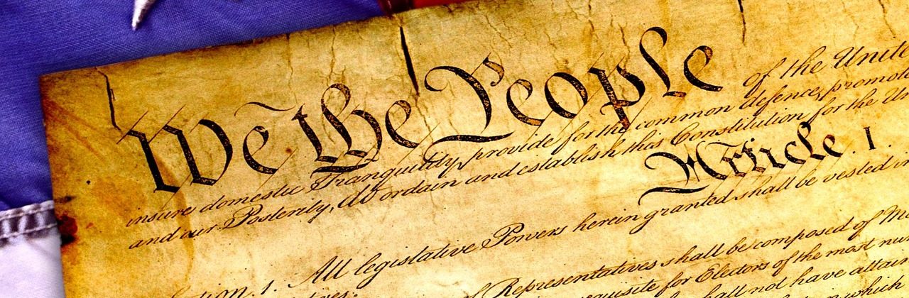 Original U.S. Constitution with flag and preamble, and the words "We the People."