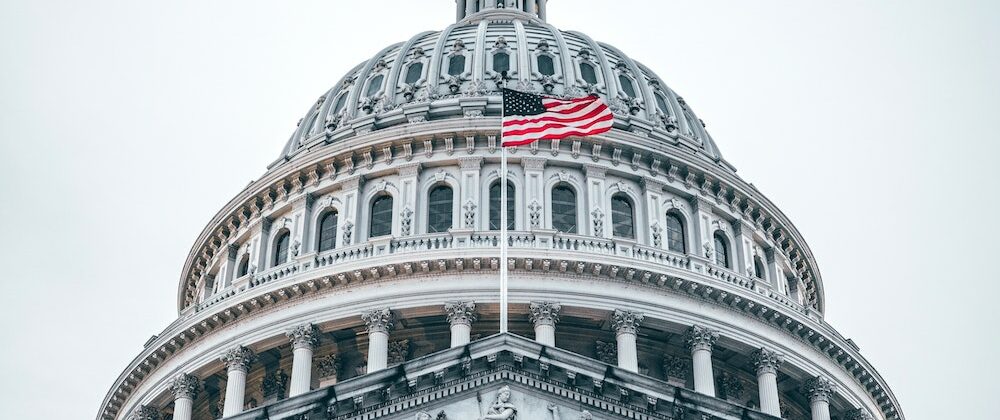 US Capitol with American flag