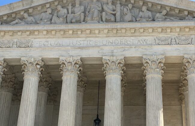 Indictment of former president;"Equal Justice Under the Law" inscribed on the front building
